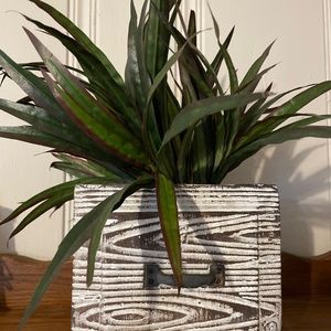 Antique weighted decor with greenery